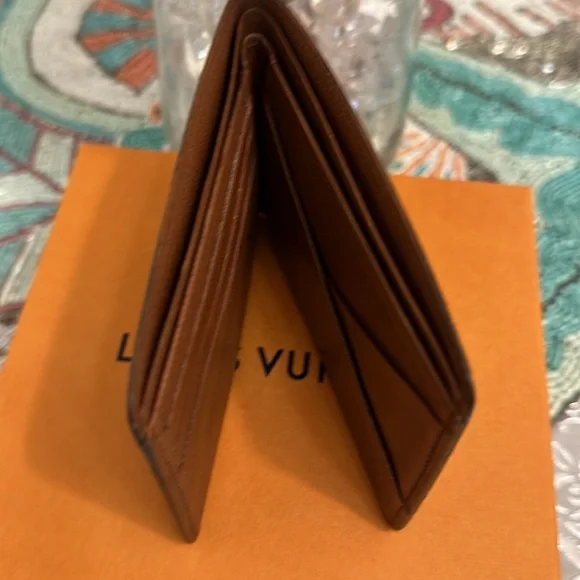 SOLD OUT Louis Vuitton Monogram 10 mans wallet this is 9/10 Authentic Lv wallet. - Picture 11 of 12